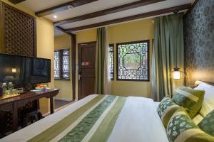 Foto de la galeria de Lijiang Gui Yuan Tian Ju Guesthouse a Lijiang
