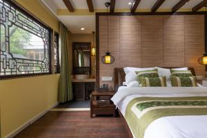 Foto de la galeria de Lijiang Gui Yuan Tian Ju Guesthouse a Lijiang