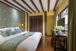 Foto de la galeria de Lijiang Gui Yuan Tian Ju Guesthouse a Lijiang