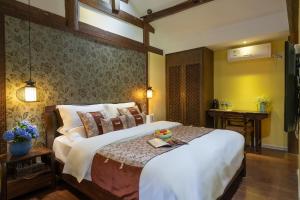 Foto de la galeria de Lijiang Gui Yuan Tian Ju Guesthouse a Lijiang