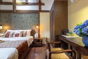 Foto de la galeria de Lijiang Gui Yuan Tian Ju Guesthouse a Lijiang
