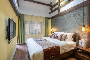 Foto de la galeria de Lijiang Gui Yuan Tian Ju Guesthouse a Lijiang