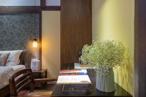 Foto de la galeria de Lijiang Gui Yuan Tian Ju Guesthouse a Lijiang