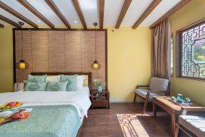 Foto de la galeria de Lijiang Gui Yuan Tian Ju Guesthouse a Lijiang