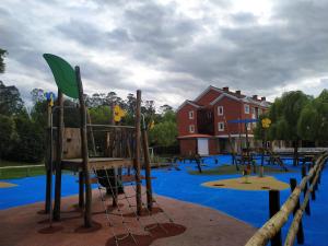 a playground with blue paint on a playground at HOTEL LA CAMPANA in Llanera