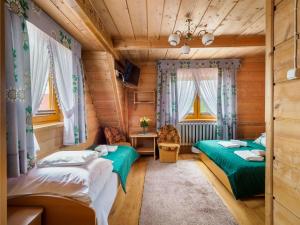 Łóżko lub łóżka w pokoju w obiekcie Pokoje Gościnne Anna Wilczek