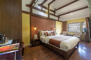 Foto de la galeria de Lijiang Gui Yuan Tian Ju Guesthouse a Lijiang