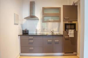 A kitchen or kitchenette at Luxury Suites Castel