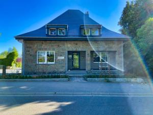 a house with a rainbow in front of it at Chalet 24 in Butgenbach