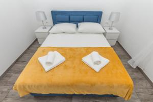 Posteľ alebo postele v izbe v ubytovaní Makarska Dalija