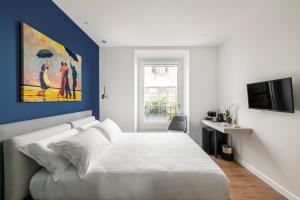 Кровать или кровати в номере Briseide Boutique Rooms Colosseum