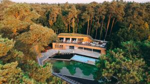 an overhead view of a house in the middle of a lake at Vital Hotel Westfalen Therme Wellness Resort & SPA in Bad Lippspringe