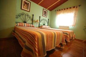Postel nebo postele na pokoji v ubytování Casas Rurales El Cobijo de Sierra Cazorla