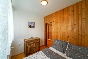 Posteľ alebo postele v izbe v ubytovaní Víkendový byt v Tatranskej Lomnici