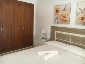 Łóżko lub łóżka w pokoju w obiekcie APARTAMENTO LA TORNA