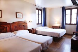 Katil atau katil-katil dalam bilik di Hostal Antxitonea