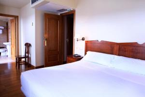 Postel nebo postele na pokoji v ubytování Hostal Antxitonea