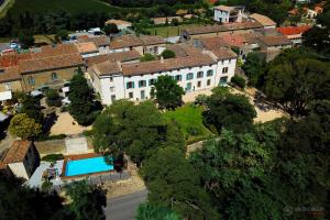 an aerial view of a house with a swimming pool at Logis Hôtel Château De Palaja in Carcassonne