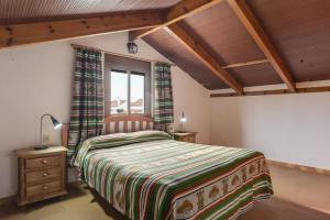 a bedroom with a bed and a window at Casa Miguelin in Zahora +23 photos