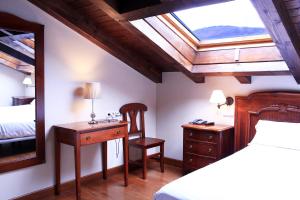 Postel nebo postele na pokoji v ubytování Hostal Antxitonea