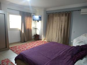 Llit o llits en una habitació de Helmeya Apartment with Touristic Views