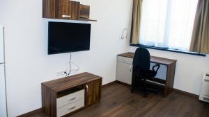 TV a/nebo společenská místnost v ubytování Stenso Rooms