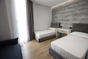 Postel nebo postele na pokoji v ubytování Mirage Hotel