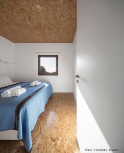 Uma cama ou camas num quarto em Monte Velho Retreat Centre