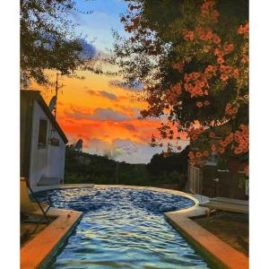 a painting of a pool with a sunset at Villa Giovanna in Sorrento