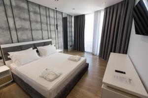 Postel nebo postele na pokoji v ubytování Mirage Hotel