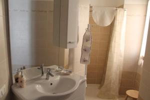 a bathroom with a sink and a shower at Paradiso sul Lago Maggiore in Baveno +52 photos