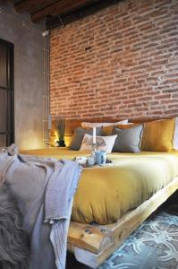 Ένα ή περισσότερα κρεβάτια σε δωμάτιο στο Maison du Flâneur