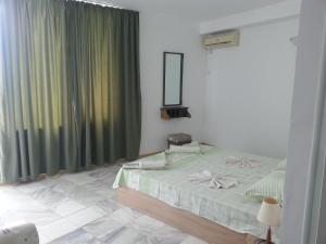Posteľ alebo postele v izbe v ubytovaní Rai Hotel