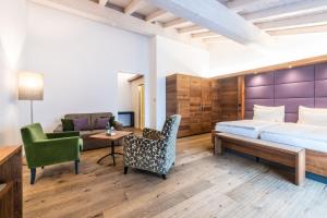 Rúm í herbergi á Hotel Lenzerhorn - Alpine Stay, Spa & Savour
