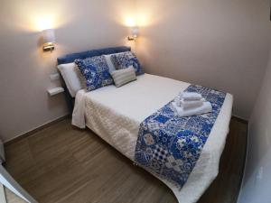 Кровать или кровати в номере Residenza le sirene