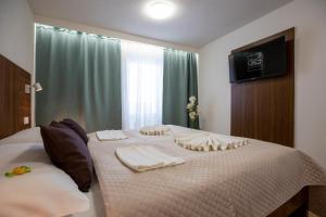 Postel nebo postele na pokoji v ubytování WX Hotel