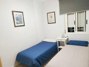 Posteľ alebo postele v izbe v ubytovaní APARTAMENTO EN EL CENTRO DE CALAFELL