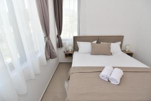 Postel nebo postele na pokoji v ubytování Apartmani Porat