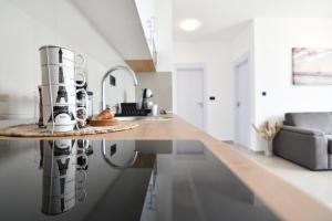 Kuchyň nebo kuchyňský kout v ubytování Apartmani Porat