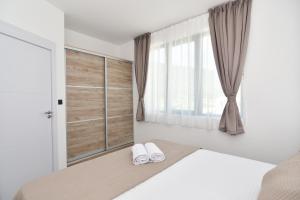 Postel nebo postele na pokoji v ubytování Apartmani Porat