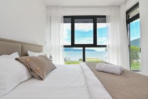 Postel nebo postele na pokoji v ubytování Apartmani Porat
