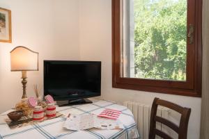 TV a/nebo společenská místnost v ubytování B&B Casa Baseggio