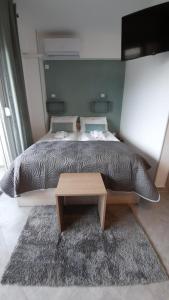 A bed or beds in a room at Apartments M, Kallikratia