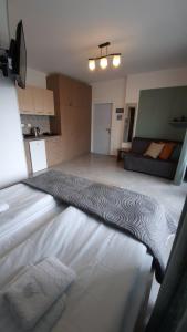 A bed or beds in a room at Apartments M, Kallikratia