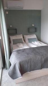A bed or beds in a room at Apartments M, Kallikratia