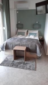 A bed or beds in a room at Apartments M, Kallikratia