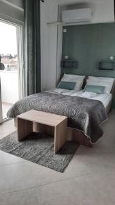 A bed or beds in a room at Apartments M, Kallikratia