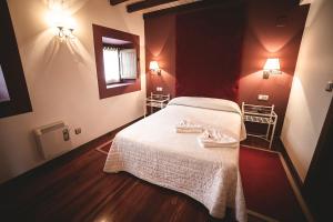 A bed or beds in a room at Posada Cicero