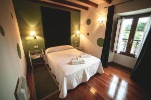 A bed or beds in a room at Posada Cicero