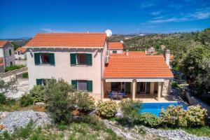 an image of a villa with a swimming pool at NEW! Villa SAN with heated pool, traditional surroundings, 3-bedrooms in Nerežišće